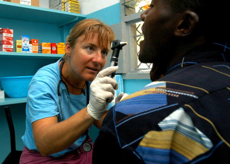 US Navy 060916-N-1328C-276 United States Army Capt. Gwynne Kinley, assigned to the 96th Civil Affairs Battalion from Hilton Head, S.C., exams patients during a Medical Civic Action Program (MEDCAP) visit to Hindi, Kenya