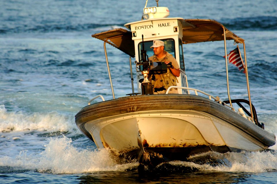 US Navy 061030-N-8148A-039 A harbor patrol boat unit from Naval Security Force Bahrain circles around the pier during a patrol mission
