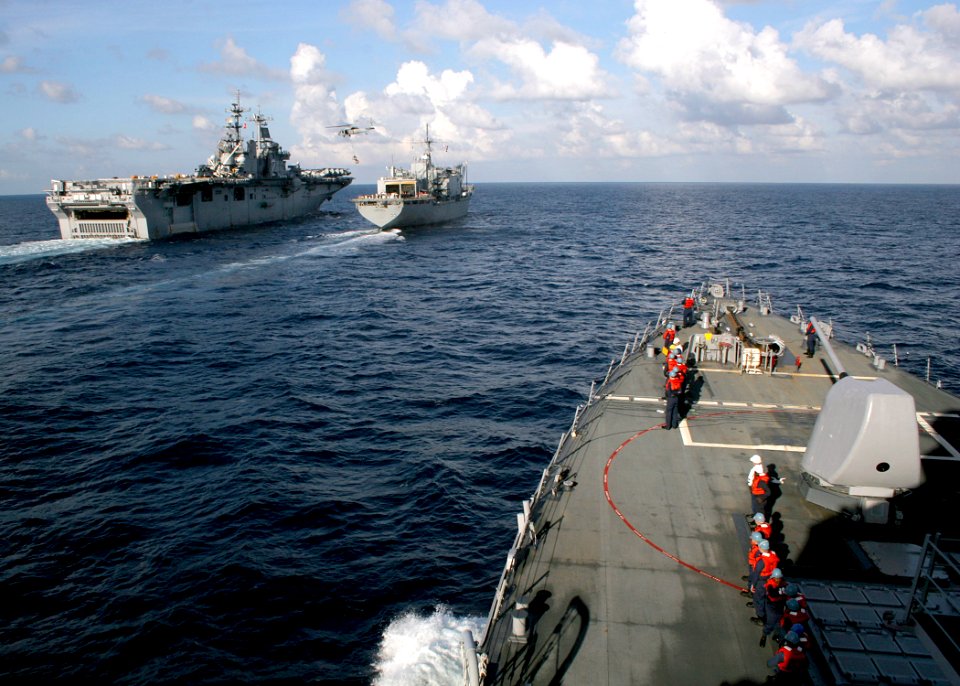 US Navy 061024-N-4953E-002 The guided missile destroyer USS Stethem (DDG 63) prepares to go alongside the Military Sealift Command combat stores ship USNS Concord (T-AFS 5) and amphibious assault ship USS Essex (LHD 2) to perfo