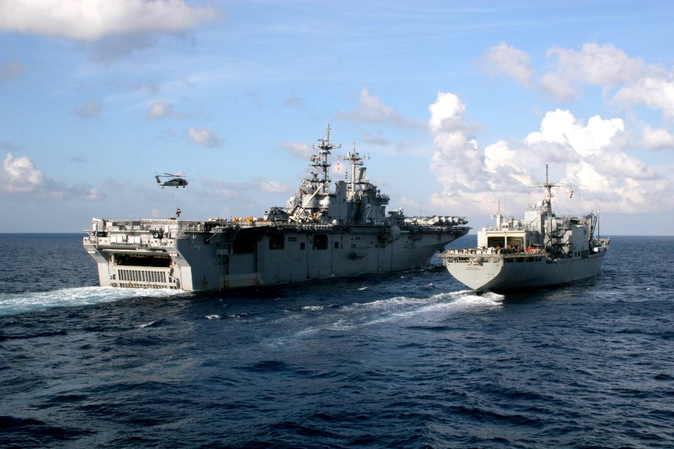 US Navy 061024-N-4953E-001 Amphibious assault ship USS Essex (LHD 2) performs a replenishment at Sea with the Military Sealift Command combat stores ship USNS Concord (T-AFS 5)