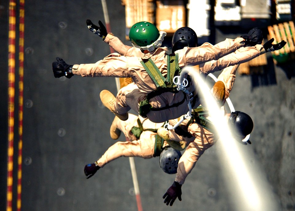 US Navy 061103-N-0490C-002 Explosive Ordnance Disposal Mobile Unit 6 (EODMU-6), Det. 16 conduct Special Purpose Insertion Extraction (SPIE) training from the flight deck of the Nimitz-class aircraft carrier USS Dwight D. Eisenh