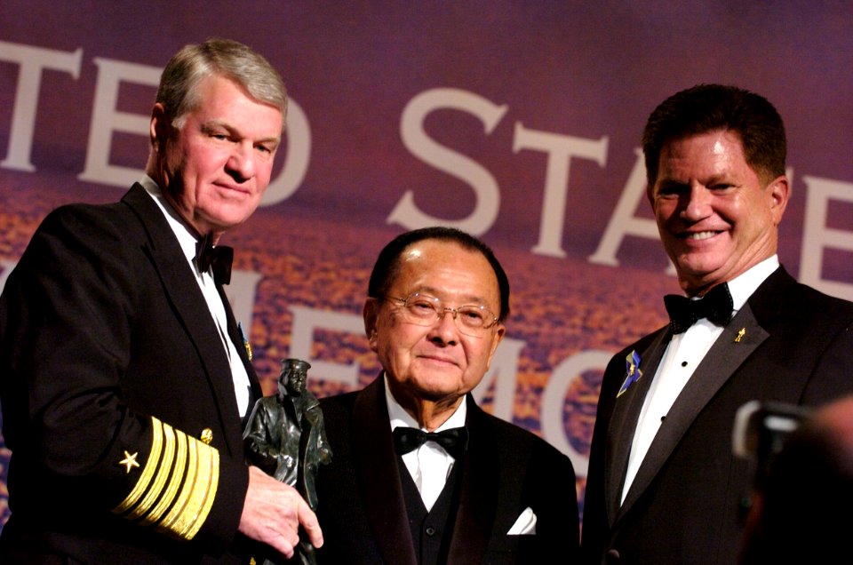 US Navy 061025-N-0696M-125 Commander, U.S. Pacific Fleet, Adm. Gary Roughhead and President and CEO of the United States Navy Memorial, Rear Adm. Richard A. Buchanan, USN (Retired) present Senator Daniel Inouye with the 2006 Na