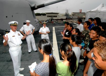 US Navy 061101-N-0879R-004 From the bow of the Pearl Harbor-based guided-missile destroyer USS Hopper (DDG 70), students from Aiea High School learn about the ship and the Navy's mission photo