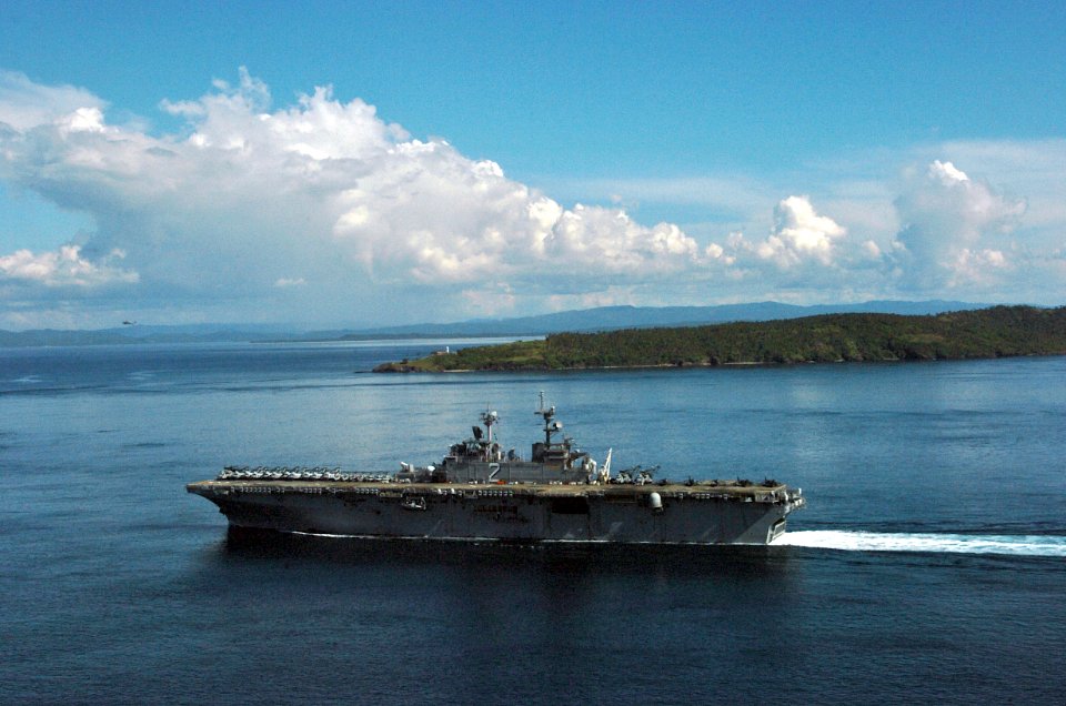 US Navy 061104-N-5067K-055 USS Essex (LHD 2) passes the Capul Island Lighthouse as it transits through the San Bernardino Straits