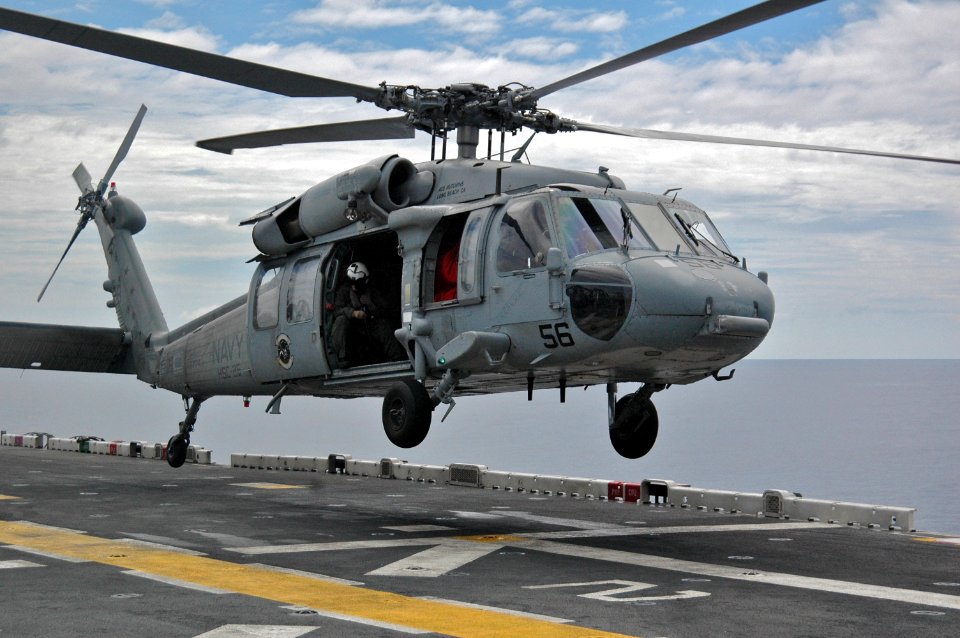 US Navy 061027-N-5067K-019 An MH-60S Seahawk assigned to Helicopter Sea Control Squadron Two Five (HSC-25) takes off from the flight deck of amphibious assault ship USS Essex (LHD 2)