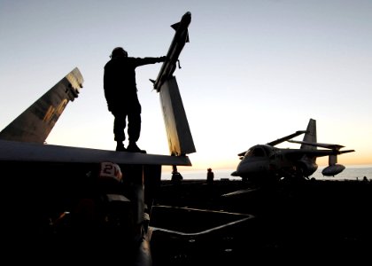 US Navy 061107-N-3729H-008 Flight deck crew members perform aircraft maintenance checks on the flight deck aboard the nuclear-powered aircraft carrier USS John C. Stennis (CVN 74)