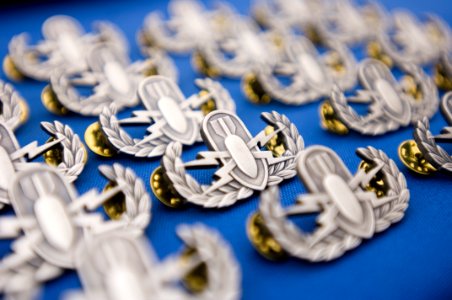 US Navy 061102-N-9769P-448 The basic explosive ordnance disposal warfare pin, or crab as it is known by EOD members, is an achievement given to military members who are dedicated to using their knowledge of explos