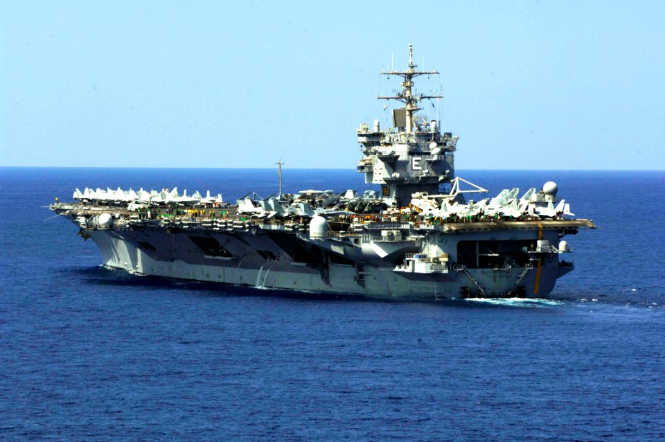 US Navy 061031-N-5330L-081 The nuclear-powered aircraft carrier USS Enterprise (CVN 65) as seen from the Nimitz-class aircraft carrier USS Dwight D. Eisenhower (CVN 69) as Eisenhower pulls alongside Enterprise for turnover