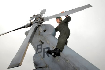 US Navy 061108-N-5459S-009 Aviation Warfare Systems Operator 3rd Class Kyle Kurzendoerfer assigned to Helicopter Sea Combat Squadron Two Eight (HSC-28) performs a tail rotor check on a MH-60S Seahawk helicopter at Naval Station