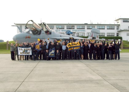 US Navy 061101-N-6247M-009 Sailors from Electronic Attack Squadron U.S. Pacific Fleet show their Navy spirit while making a video for the halftime show of the Army-Navy football game
