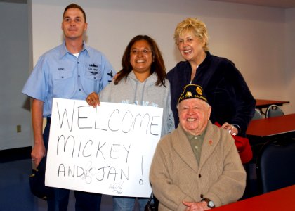 US Navy 061103-N-8102J-057 Legalman 1st Class Chris Holt and his wife takes a photo with film, stage and singing star, Mickey Rooney and his wife Jan during a visit at Mayport's United Services Organization (USO) office