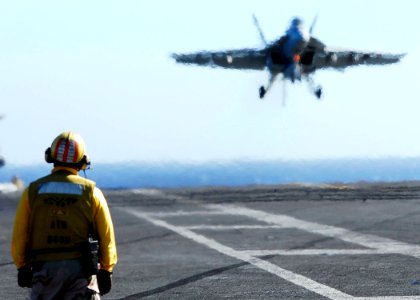 US Navy 061113-N-3729H-034 An F-A-18F Super Hornet assigned to the Black Knights of Strike Fighter Squadron One Five Four (VFA-154) lands aboard the flight deck of nuclear-powered aircraft carrier USS John C. Stennis (CVN 74)