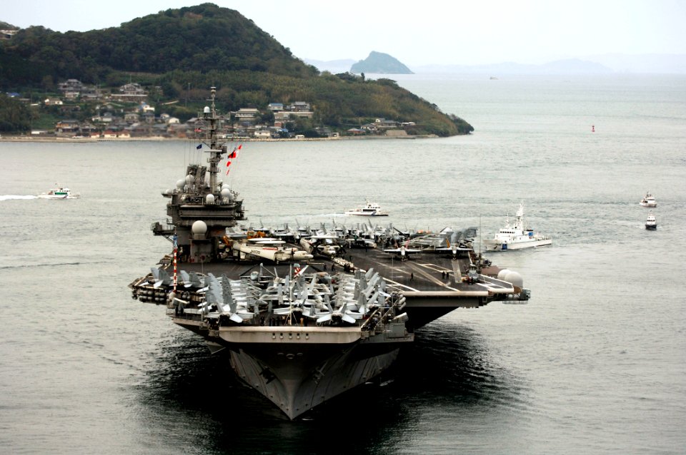 US Navy 061106-N-6106R-938 USS Kitty Hawk (CV 63) prepares to drop it anchors in the harbor of Sasebo during a scheduled port visit