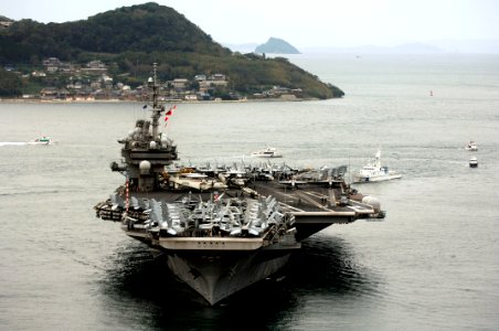 US Navy 061106-N-6106R-938 USS Kitty Hawk (CV 63) prepares to drop it anchors in the harbor of Sasebo during a scheduled port visit