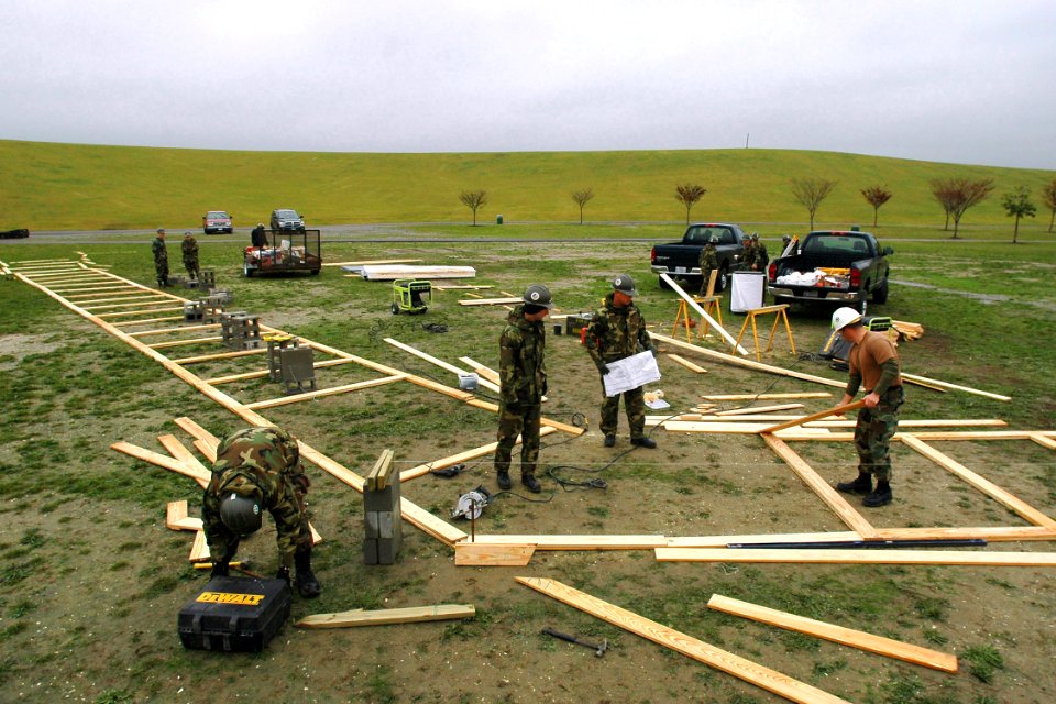 US Navy 061113-N-4515N-102 Construction Battalion Maintenance Unit Two Zero Two (CBMU-202) attached to Naval Amphibious Base Little Creek, work on the foundation for the Dignity Memorial Vietnam Wall at Mt. Trashmore Park