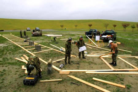 US Navy 061113-N-4515N-102 Construction Battalion Maintenance Unit Two Zero Two (CBMU-202) attached to Naval Amphibious Base Little Creek, work on the foundation for the Dignity Memorial Vietnam Wall at Mt. Trashmore Park