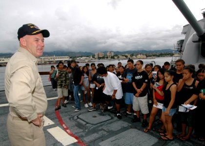US Navy 061101-N-0879R-003 From the bow of the Pearl Harbor-based guided-missile destroyer USS Hopper (DDG 70), students from Aiea High School learn about the ship and the Navy's mission photo