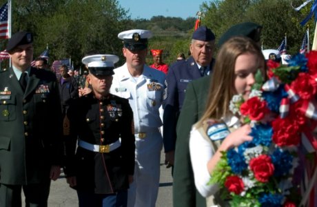 US Navy 061111-N-3750S-015 USS San Antonio (LPD 17) Command Master Chief Tom Meglen participates in a wreath laying ceremony with representatives all branches of the military services during the Veterans Day ceremony at Fort Sa