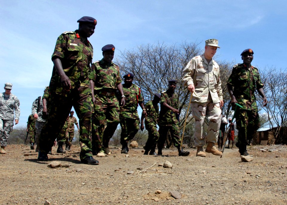 US Navy 061103-N-1328C-514 Deputy Commander of Combined Joint Task Force - Horn of Africa (JTF-HOA), U.S. Navy Rear Adm. Tim Moon (center), receives a tour from Kenyan Army Brig. Gen. Leornard Ngondi