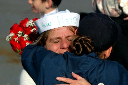 US Navy 061106-N-4515N-216 Engineman 2nd Class Heidi Friedman embraces her mother at the homecoming ceremony for the guided-missile destroyer USS Ross (DDG 71)