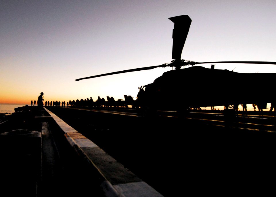 US Navy 061107-N-3729H-036 Flight deck crew members conduct a Foreign Object Debris (FOD) walkdown on the flight deck of the nuclear-powered aircraft carrier USS John C. Stennis (CVN 74)