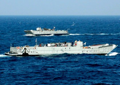 US Navy 061030-N-8547M-085 Landing Craft Utility 1656 and 1658 underway in the Persian Gulf performing small boat operations moments after departing the well deck of amphibious assault ship USS Saipan