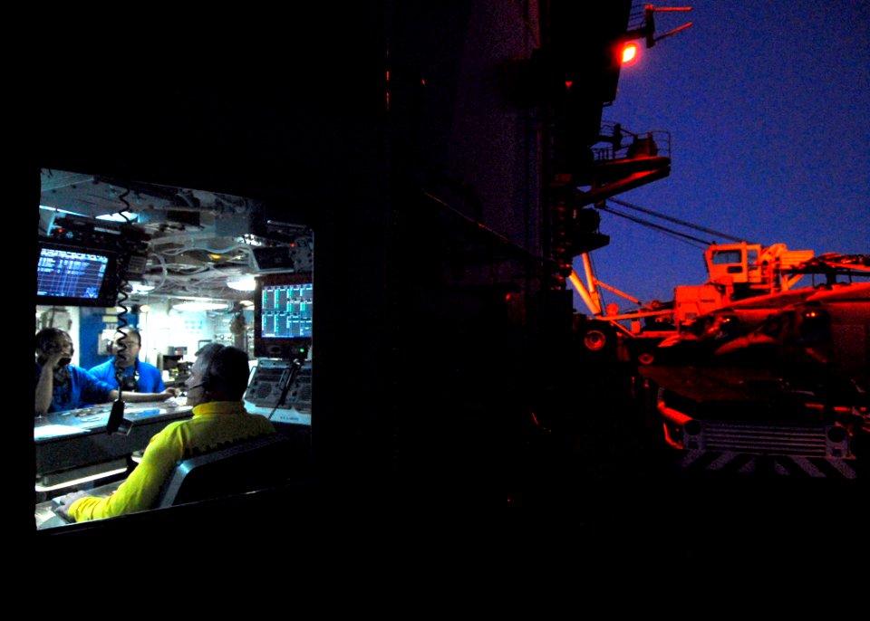 US Navy 061107-N-3729H-074 Sailors in flight deck control debrief after operations aboard the nuclear-powered aircraft carrier USS John C. Stennis (CVN 74)