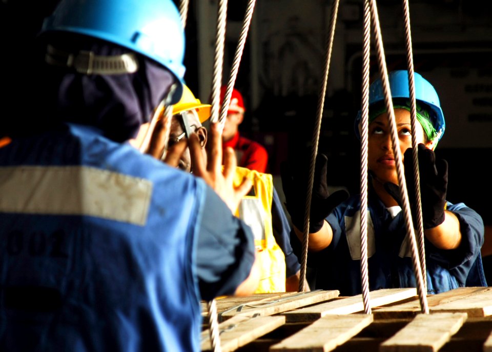 US Navy 061108-N-8907D-002 Sailors aboard Nimitz-class aircraft carrier USS Dwight D. Eisenhower (CVN 69) pallet wooden crates during an underway replenishment (UNREP) with the Military Sealift Command fleet replenishment oiler