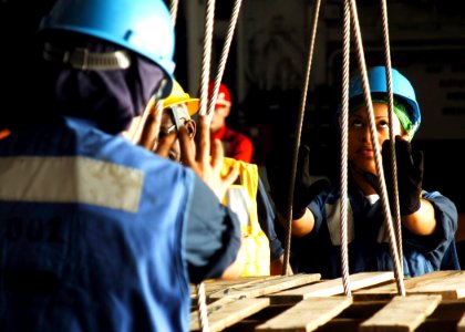 US Navy 061108-N-8907D-002 Sailors aboard Nimitz-class aircraft carrier USS Dwight D. Eisenhower (CVN 69) pallet wooden crates during an underway replenishment (UNREP) with the Military Sealift Command fleet replenishment oiler