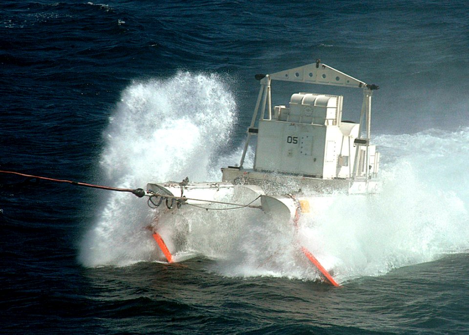 US Navy 061107-N-8547M-022 An MK-105 mine countermeasure sled crashes through the waves while being towed