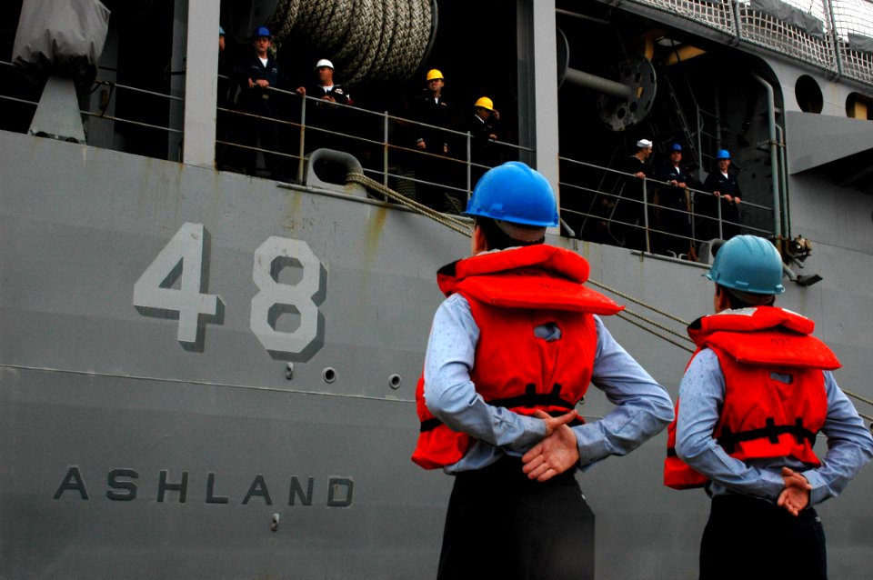 US Navy 061116-N-2456S-189 Line handlers of the Harper's Ferry-class dock landing ship USS Oak Hill (LSD 51) prepare the Whidbey Island-class dock landing ship USS Ashland (LSD 48) for deployment