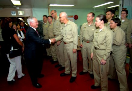 US Navy 071006-F-6655M-092 Secretary of Defense Robert M. Gates greets crew members and receives a tour of the facilities aboard the Military Sealift Command (MSC) hospital ship USNS Comfort photo