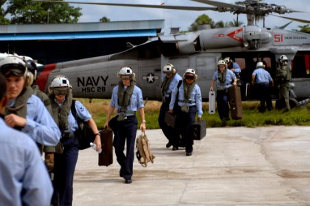 US Navy 071005-N-0194K-006 The U.S. Navy Showband, attached to the Military Sealift Command hospital ship USNS Comfort (T-AH 20), debark an MH-60S helicopter assigned to Helicopter Sea Combat (HSC) Squadron 28