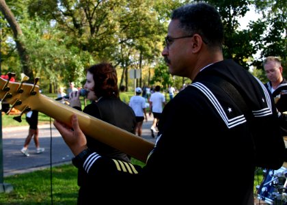 US Navy 071007-N-7163S-003 Sailors assigned to Navy Band Great Lakes Horizon entertain passing runners at the 15-mile marker of the Twin Cities Marathon