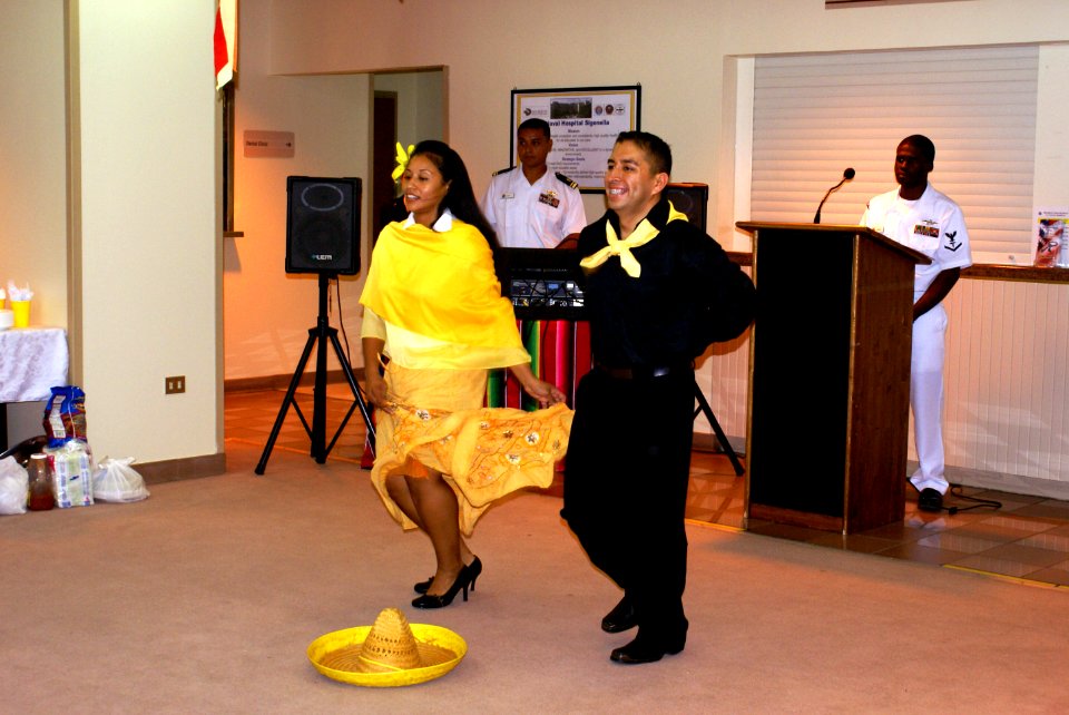 US Navy 071010-N-3202N-002 Hospital Corpsman 2nd Class Alejandro Alcala and Mrs. Elizabeth Taylor performs the Mexican Hat Dance in celebration of the Hispanic Heritage Month at U.S. Naval Hospital Sigonella
