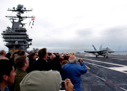 US Navy 071006-N-7981E-303 An F-A-18C assigned to Warhawks of Strike Fighter Squadron (VFA) 97 touches down on the flight deck of Nimitz-class aircraft carrier USS Abraham Lincoln (CVN 72)