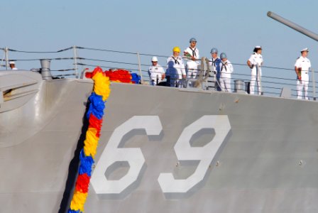 US Navy 071008-N-9909C-005 An Sailor holds on to a bouquet of roses as guided-missile destroyer USS Milius (DDG 69) prepares to pull pierside in San Diego