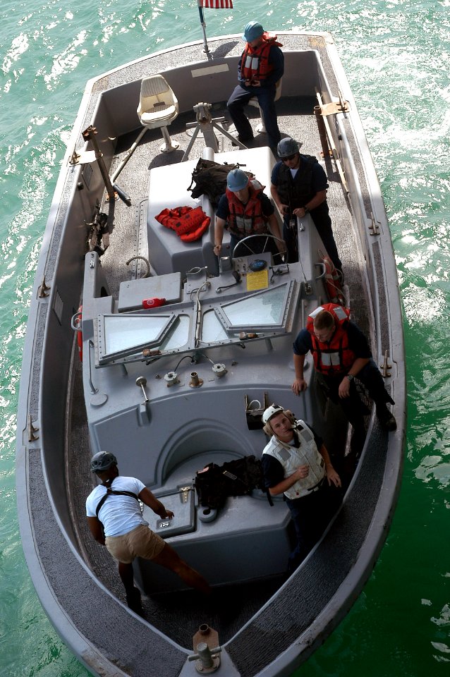 US Navy 071010-N-5642P-019 A landing craft personnel large boat pulls away from amphibious assault ship USS Kearsarge (LHD 3) photo