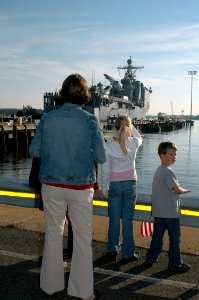 US Navy 071016-N-1082Z-005 Family members of Lt. Cmdr. Thomas Kait, executive officer of dock landing ship USS Fort McHenry (LSD 43), watch as the ship departs from Naval Amphibious Base Little Creek