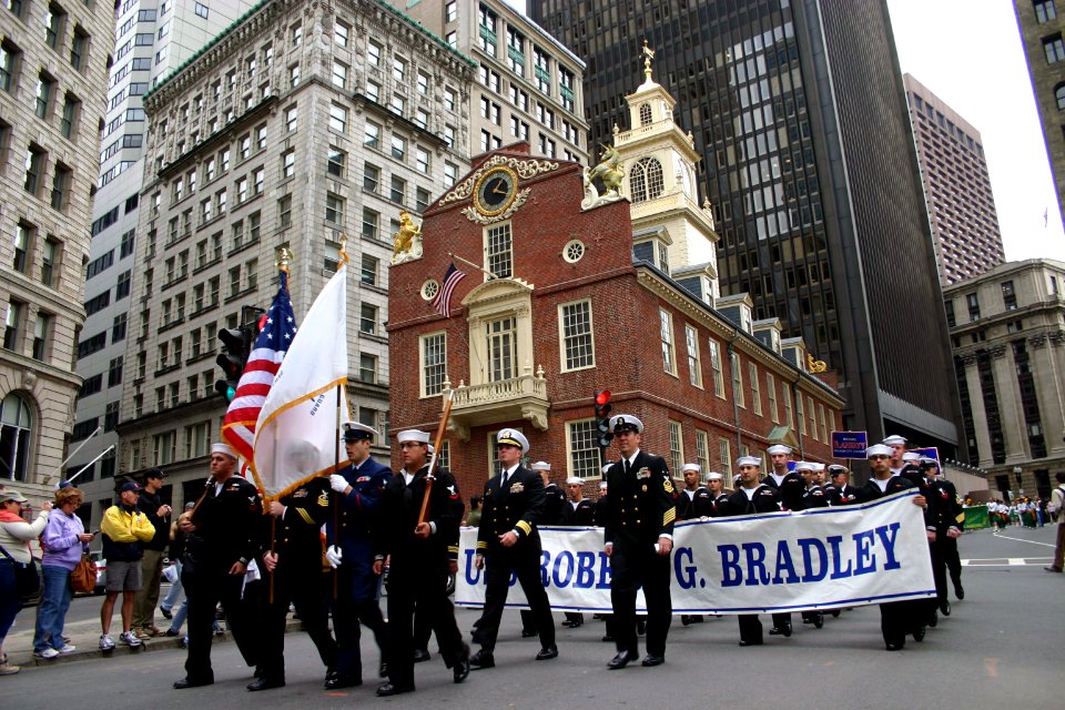 US Navy 071007-N-8110K-003 Crew members of the guided-missile frigate USS Bradley (FFG 49) pass the Old State House in downtown Boston during the annual Columbus Day Parade