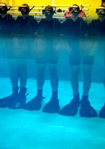 US Navy 071010-N-5319A-014 Rescue Swimmer School candidates line up in the pool for daily buddy towing drills at Naval Air Station Pensacola