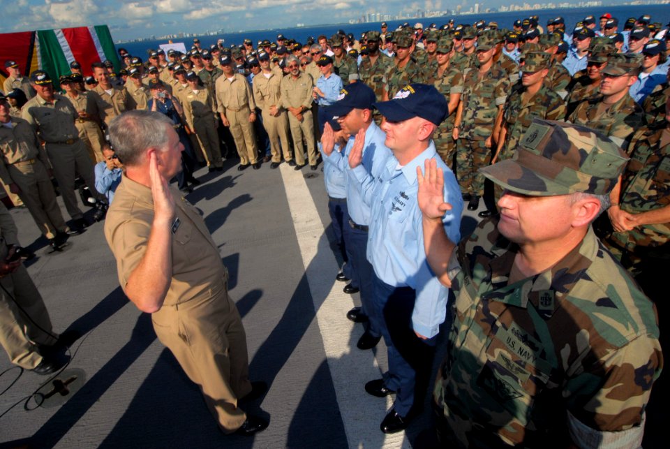 US Navy 071012-N-8704K-048 Sailors take the oath of reenlistment, administered by Chief of Naval Operations (CNO) Adm. Gary Roughead, during a welcome home ceremony aboard Military Sealift Command hospital ship USNS Comfort (T