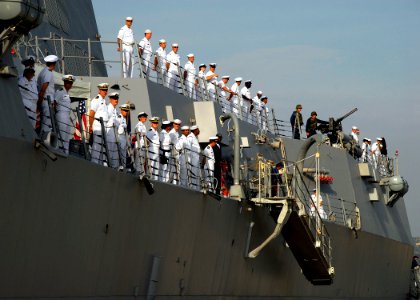 US Navy 071008-N-0780F-003 Sailors man the rails as Arleigh Burke-class guided-missile destroyer USS Momsen (DDG 96) arrives in Souda harbor for a routine port visit