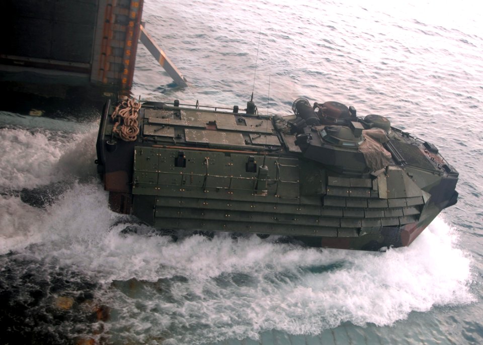 US Navy 071010-N-6710M-011 A landing craft utility exits the well deck of dock landing ship USS Tortuga (LSD 46) while transiting equipment