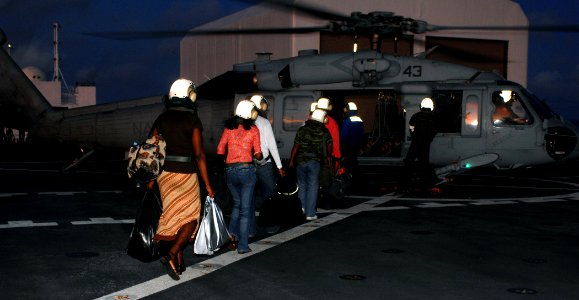 US Navy 071007-N-7088A-034 The last patients to receive care aboard the Military Sealift Command hospital ship USNS Comfort (T-AH 20), board an MH-60S helicopter in preparation to depart the ship
