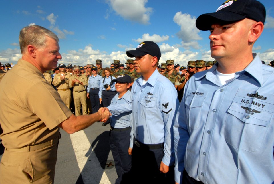 US Navy 071012-N-8704K-061 Adm. Gary Roughead congratulates Sailors after a reenlistment ceremony aboard USNS Comfort