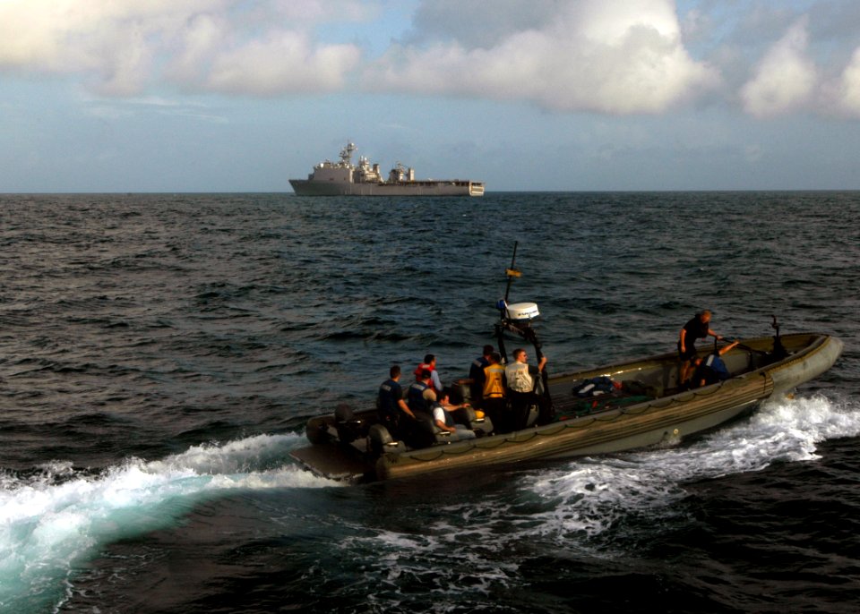 US Navy 071007-N-4014G-014 Sailors aboard a rigid hull inflatable boat from dock landing ship USS Carter Hall (LSD 50) depart guided-missile destroyer USS Porter (DDG 78) during a personnel transfer