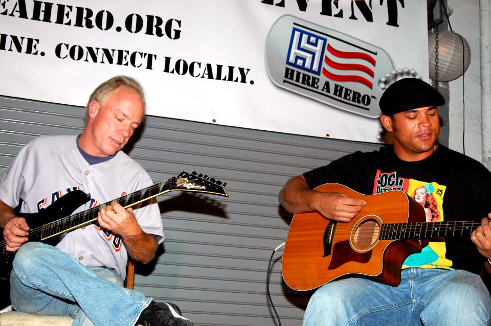 US Navy 071018-N-0890S-135 Brian Conreux (left) and Stan Miner provide entertainment while military members participate in Hire A Hero, an event that promotes networking for military members