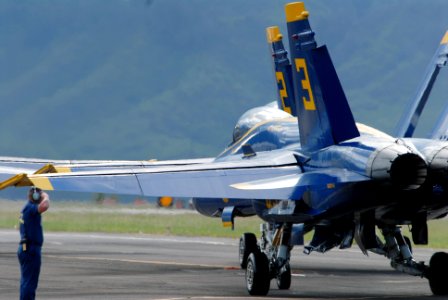 US Navy 071014-N-5476H-279 Two Blue Angels jets taxi down the runway prior to takeoff during the Blues on the Bay Air Show at Marine Corps Base Hawaii
