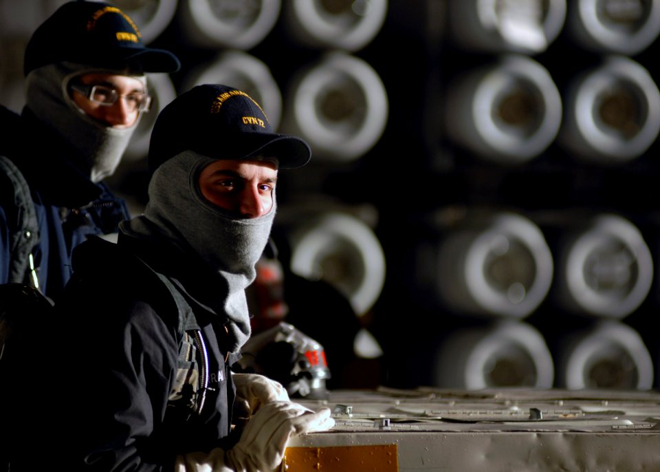 US Navy 071016-N-7981E-092 Members of air department stand fire watch in the hangar bay of Nimitz-class aircraft carrier USS Abraham Lincoln (CVN 72) during an ordnance onload at Naval Magazine Indian Island